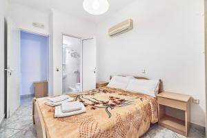A bed or beds in a room at The Mardim Villa