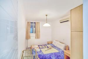 A bed or beds in a room at The Mardim Villa