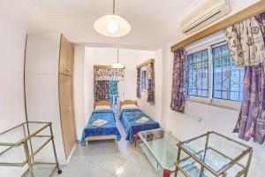 A bed or beds in a room at The Mardim Villa
