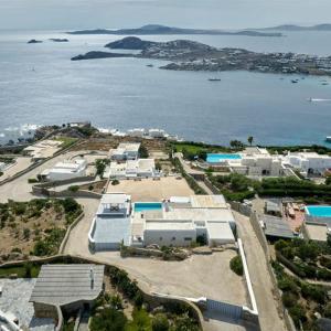 an aerial view of a resort with a body of water at Stunning 7-Bed Villa Villa Panamera in Psarou