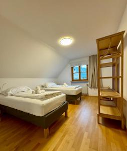 Posteľ alebo postele v izbe v ubytovaní Bauernchalet Alois