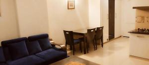 Χώρος καθιστικού στο Gold Suite 402 Bhurban