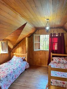 Ένα ή περισσότερα κρεβάτια σε δωμάτιο στο la casa de isla negra
