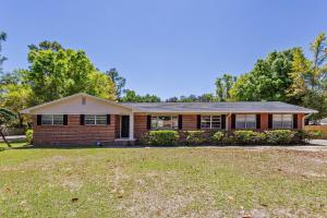 a red brick house with a large yard at 2967 Swan Lane in Pensacola