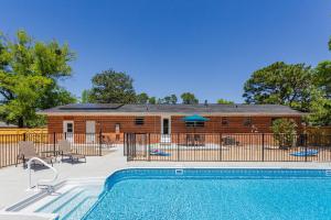 a swimming pool in front of a house at 2967 Swan Lane in Pensacola