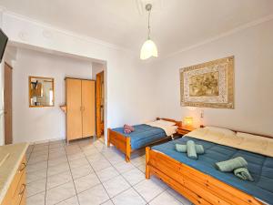 Voodi või voodid majutusasutuse Hotel Exarhos toas