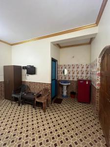 a room with a bathroom with a sink and a table at Casa De Calangute Beach in Calangute