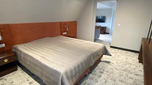 Posteľ alebo postele v izbe v ubytovaní Ołowianka B&B