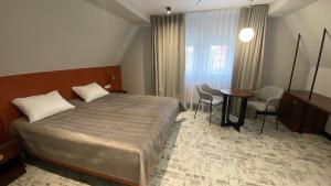 Posteľ alebo postele v izbe v ubytovaní Ołowianka B&B