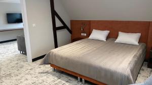 Posteľ alebo postele v izbe v ubytovaní Ołowianka B&B