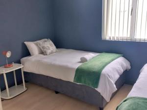 Giường trong phòng chung tại SPERANZA