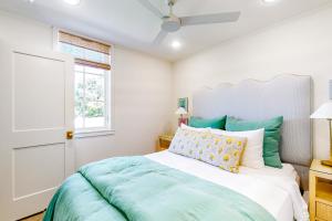 a bedroom with a bed and a window at Eco-Chic Lake Somerville Area Farmhouse w/ Porch in Brenham