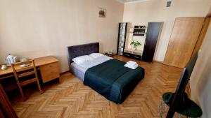 Postel nebo postele na pokoji v ubytování Kaunas Center Apartment