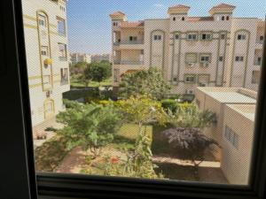 a view from a window of a city with buildings at Heliopolis Residence Shorouk city, Cairo (premium) in Madīnat ash Shurūq