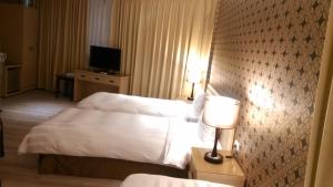 Letto o letti in una camera di A casa Hotel
