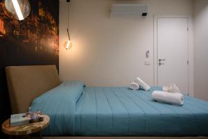 מיטה או מיטות בחדר ב-INCAO HOLIDAY LA STRUMMULA HOUSE
