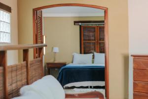 a bedroom with a bed and a large mirror at Pousada Fruta Pão in Barra Grande +126 photos