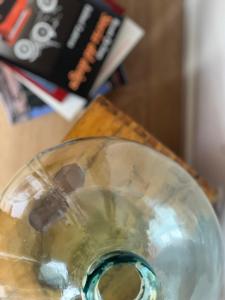 a glass vase sitting on top of a table at Loft G Hospitality in Milan