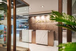 a lobby of a store with a sign on the wall at Orya Hotel in Istanbul