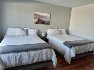 Ліжко або ліжка в номері Motel Cabano-Relais