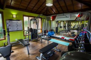 a gym with several treadmills and exercise equipment at Eco Resort Serra Imperial in São Pedro da Serra
