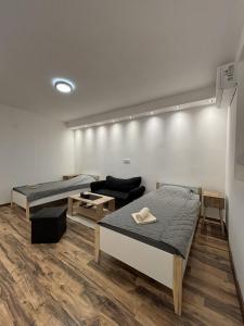 Кровать или кровати в номере Apartman Centar