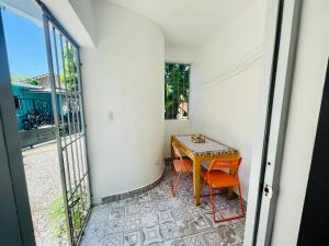 a small room with a table and two chairs at Mango House. Mono 2 bedrooms in Cabarete
