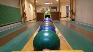 a bowling lane with a ball on the lanes at Hotel-Restaurant Kolpinghaus in Lingen