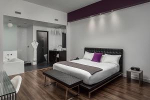 Postel nebo postele na pokoji v ubytování Hotel Metro