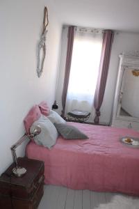 Postel nebo postele na pokoji v ubytování Chambre d'hôtes Les Magnolias