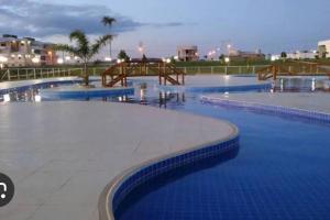 The swimming pool at or close to Casa com 4 suítes, todas as suítes com ar condicio