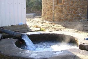 a water fountain with water coming out of it at White Desert Safari in Bawati