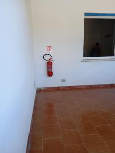 a fire hydrant on the wall of a room at Casa Pipere in Santa Lucia