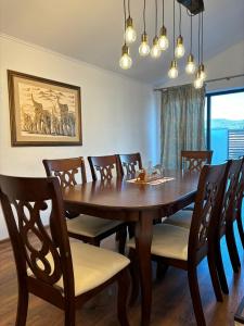 a dining room with a wooden table and chairs at Casa Mara in Cristian