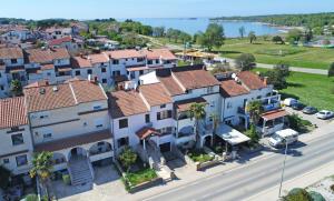 an aerial view of a town with houses at Only 250m from the sea in Funtana