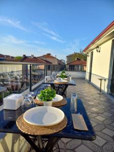 a table with plates on it on a patio at GRANDAURA EDıRNE in Edirne