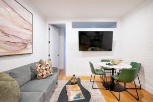 a living room with a couch and a table at 1288-3RS New Renovated 2 Bedrooms in New York