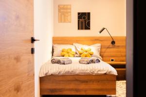 a bedroom with a bed with pumpkins on it at Magical Design Home in Tarvisio in Tarvisio +12 photos