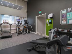 a gym with cardio equipment and a treadmill at Lodge 1 in St Asaph