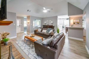 a living room with a couch and a table at Cozy Carrollton Cottage with Fire Pit and Gas Grill! in Carrollton