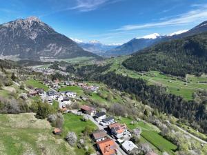 an aerial view of a village in the mountains at Apart Alpenzeit in Arzl im Pitztal