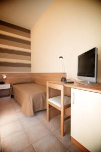 TV a/nebo společenská místnost v ubytování Hotel Velus