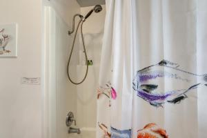 a shower with a white shower curtain in a bathroom at Dog-Friendly Westover Cottage with River Access! in Marion +22 photos
