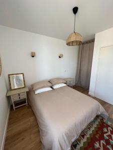 Ένα ή περισσότερα κρεβάτια σε δωμάτιο στο La Villa du fleuve