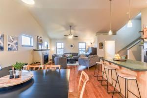 a kitchen and living room with a table and chairs at Palouse View Villa in Moscow