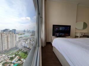 a hotel room with a view of a city at Vinhome Landmark 81 Suites in Ho Chi Minh City