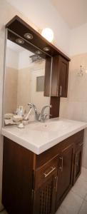 a bathroom with a sink and a mirror at Exclusive Jerusalem Villa in Giv‘ot Mordekhay