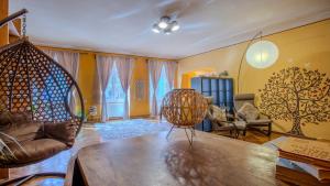 a living room with a couch and a table at TREE House-Old Town Brașov in Braşov +35 photos