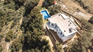 an aerial view of a house with a swimming pool at Maroulas Natura Palace in Giannoudi