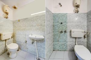a bathroom with a toilet and a sink at OYO Flagship White Inn Near Golden Tower in Chennai
